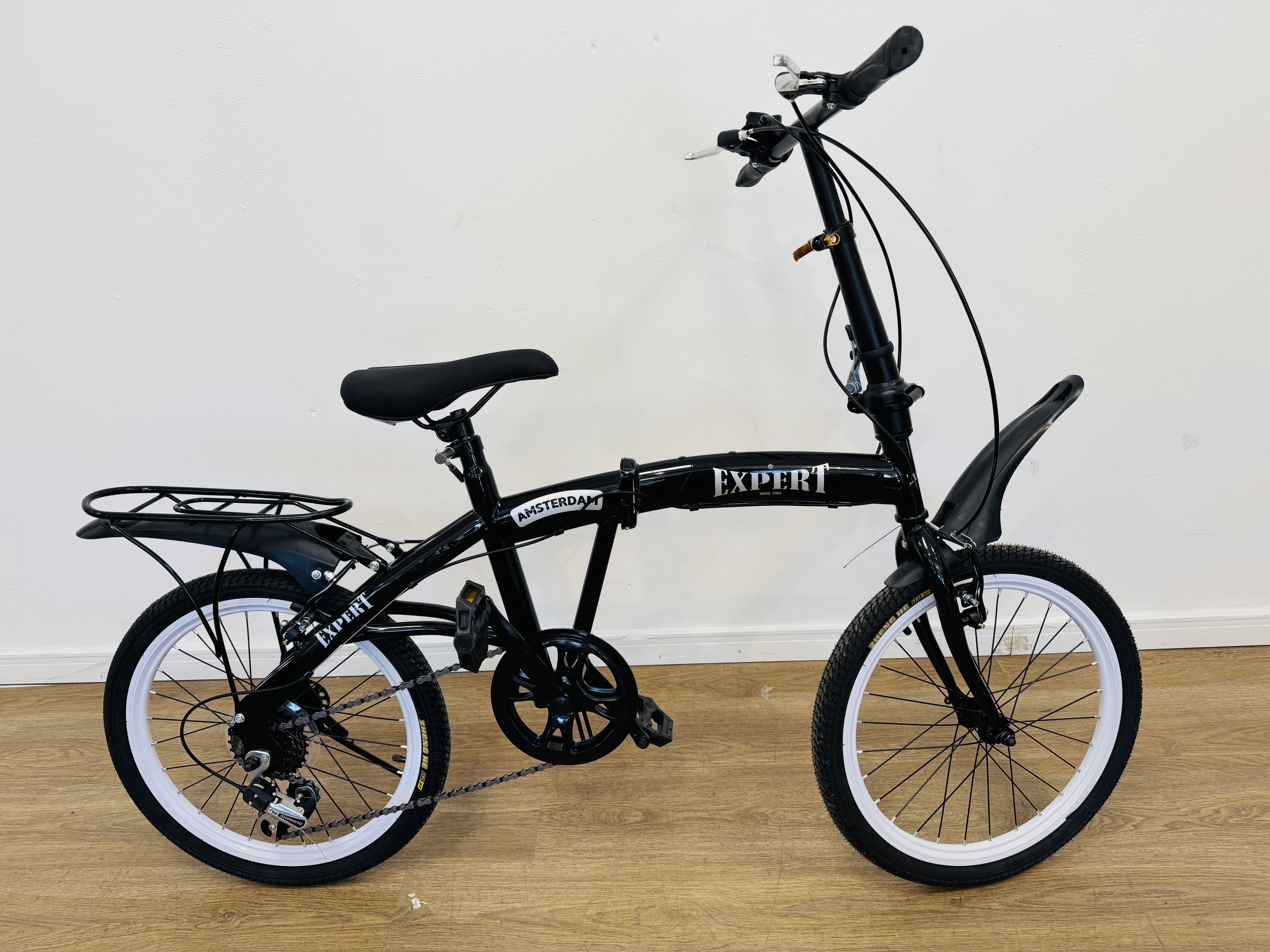 Lote #005 - Bicicleta Expert Amsterdam plegable rodado 20, con cambios - necesita ajuste en el freno delantero y tranca de pliego